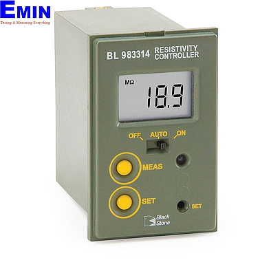 Technician inspecting an online water resistivity controller in an industrial water monitoring system
